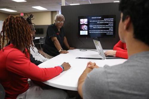 Professor speaks with students